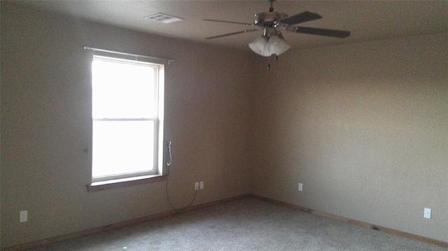 carpeted empty room with ceiling fan