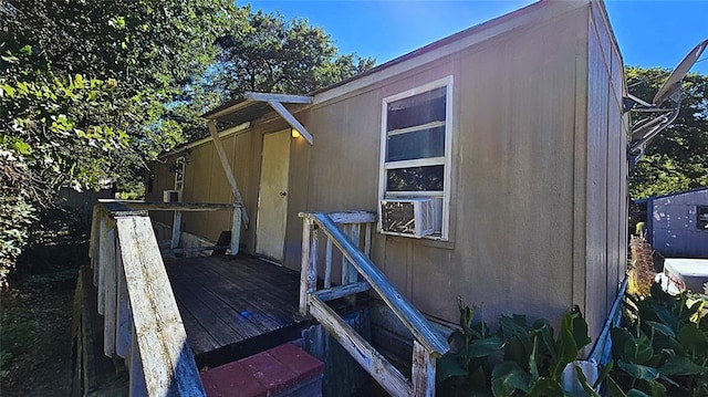 view of home's exterior featuring a wooden deck