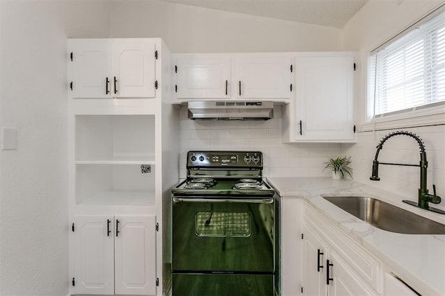 kitchen with white cabinets, sink, vaulted ceiling, and black range with electric cooktop