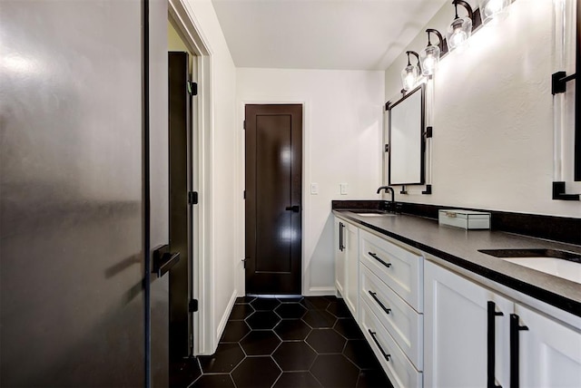 bathroom with vanity and tile patterned floors