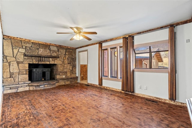 unfurnished living room featuring ceiling fan and hardwood / wood-style floors