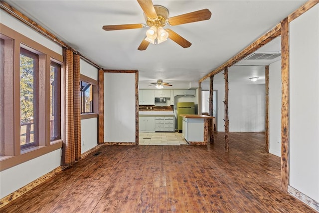 unfurnished living room with hardwood / wood-style floors