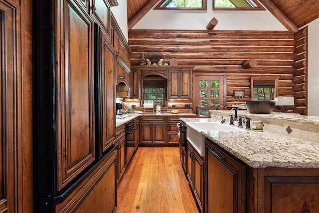 kitchen featuring a center island with sink, high vaulted ceiling, wooden ceiling, and light wood-type flooring