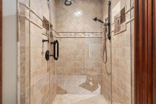 bathroom with a tile shower