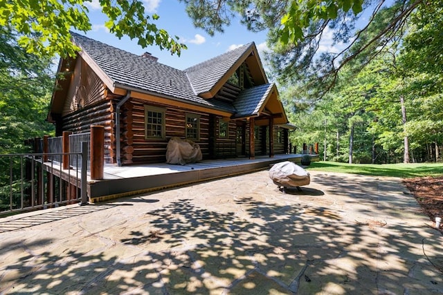 back of house with a patio area