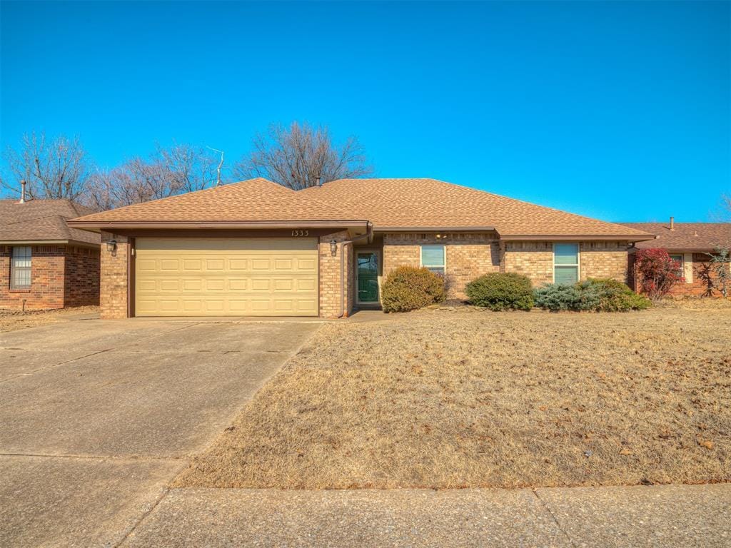 single story home featuring a garage