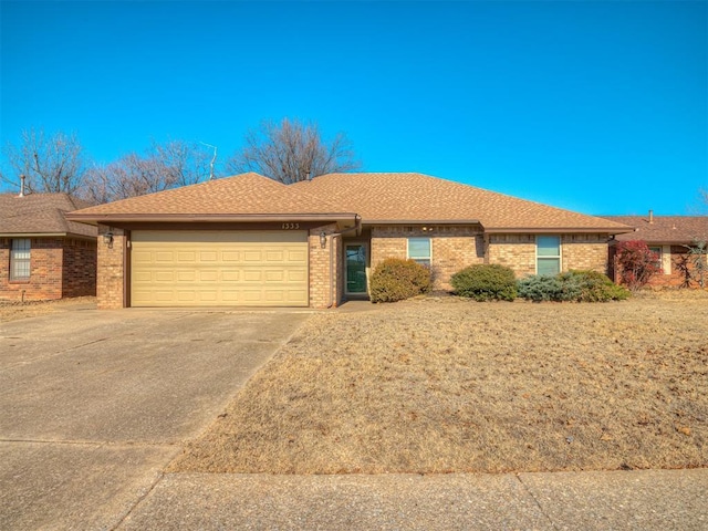 single story home featuring a garage