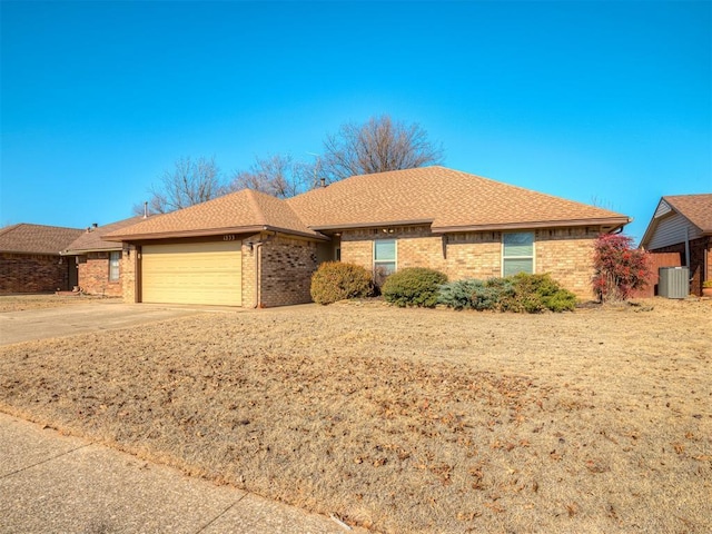 ranch-style home featuring a garage