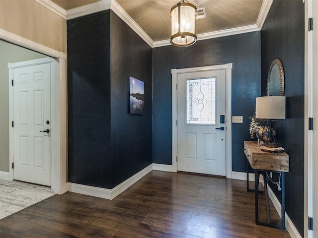 foyer with dark wood-type flooring and ornamental molding