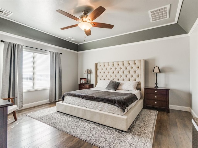 bedroom with lofted ceiling, hardwood / wood-style flooring, ceiling fan, and ornamental molding