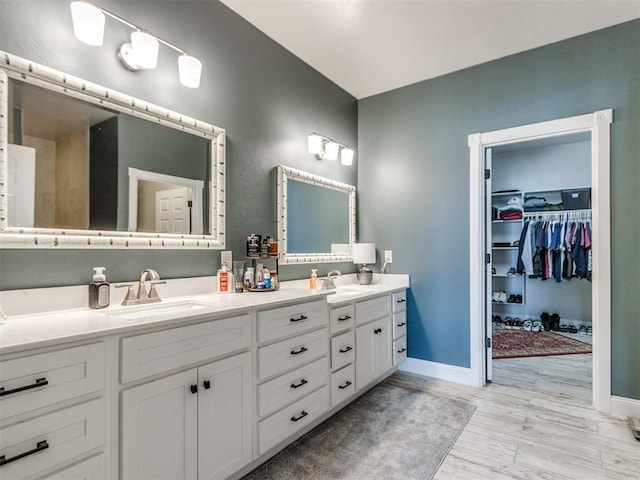 bathroom with vanity and wood-type flooring