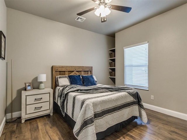 bedroom featuring ceiling fan and dark hardwood / wood-style flooring