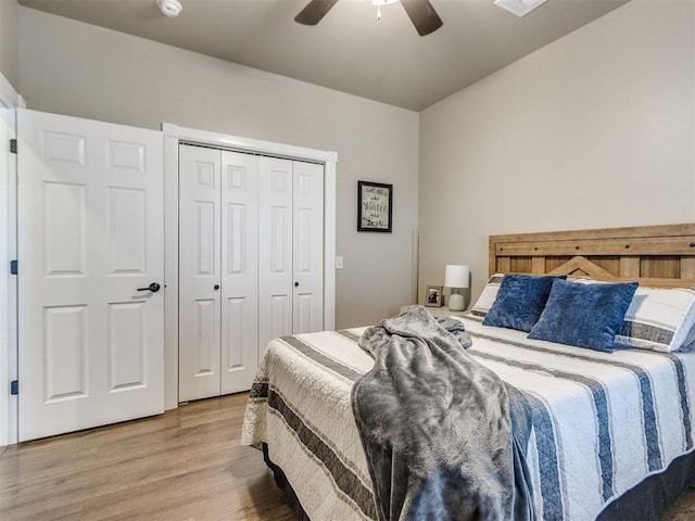 bedroom with a closet, ceiling fan, and hardwood / wood-style flooring