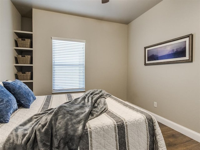 bedroom with wood-type flooring