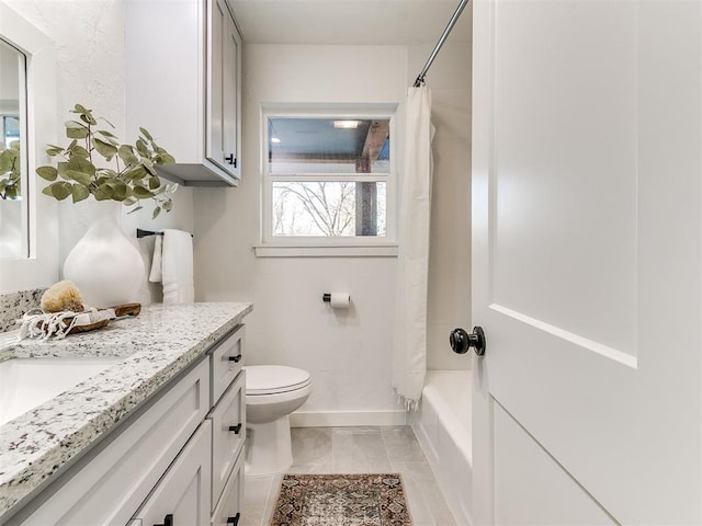 full bathroom featuring vanity, tile patterned floors, toilet, and shower / bath combo