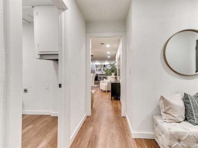 hallway featuring light hardwood / wood-style floors