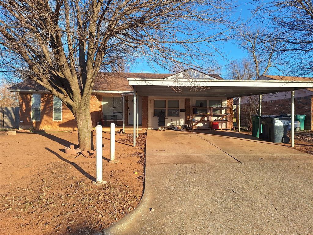 view of front of home with a carport