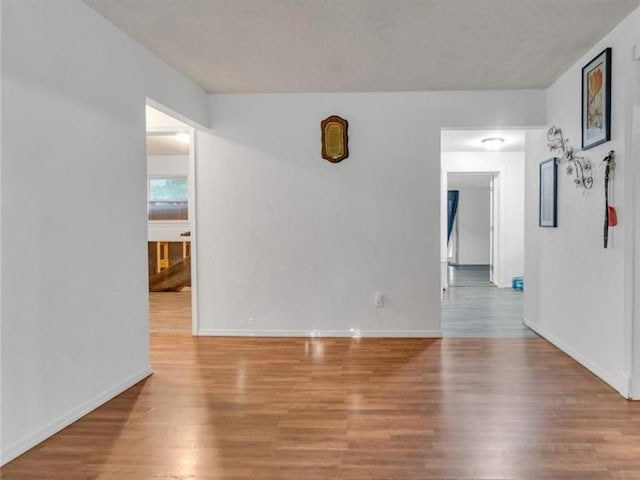 spare room with light hardwood / wood-style floors