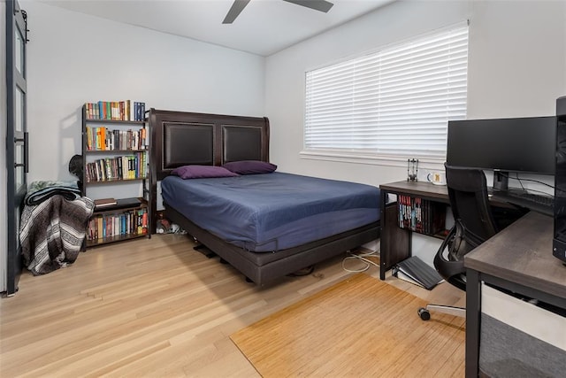 bedroom with light wood-type flooring and ceiling fan