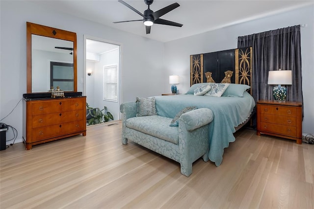 bedroom with light hardwood / wood-style floors and ceiling fan