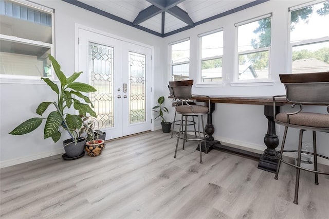 sunroom / solarium with french doors and lofted ceiling with beams