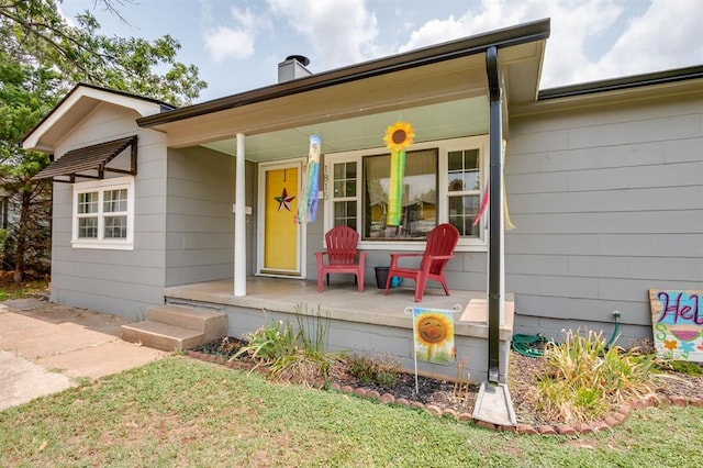 1815 N Bell Ave, Shawnee, OK 74804 - view of front of home with a porch and a chimney