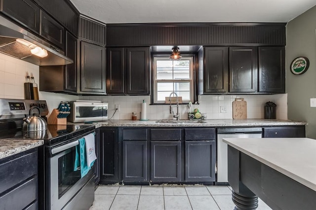 1815 N Bell Ave, Shawnee, OK 74804 - kitchen featuring appliances with stainless steel finishes, a sink, under cabinet range hood, and tasteful backsplash
