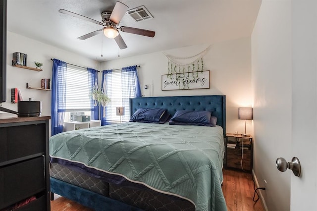 1815 N Bell Ave, Shawnee, OK 74804 - bedroom featuring wood finished floors, ceiling fan, and baseboards