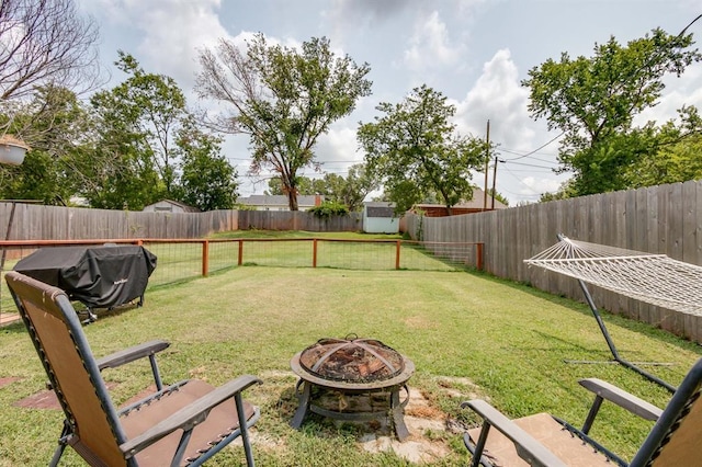 1815 N Bell Ave, Shawnee, OK 74804 - view of yard with a fire pit and a shed