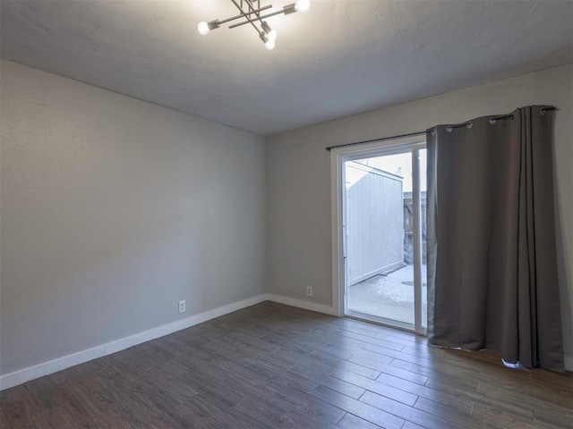 unfurnished room featuring dark wood-type flooring