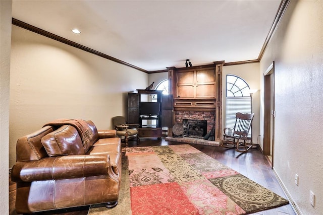 living room featuring a brick fireplace, ornamental molding, and dark hardwood / wood-style floors