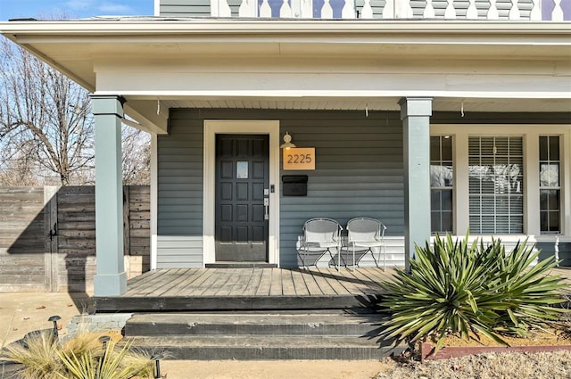 entrance to property featuring a porch