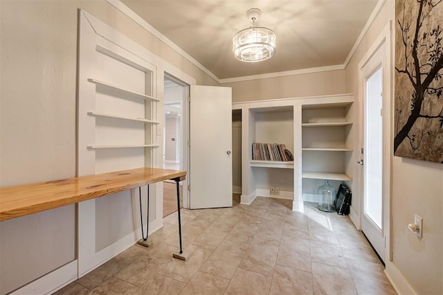 interior space featuring an inviting chandelier, ornamental molding, and plenty of natural light