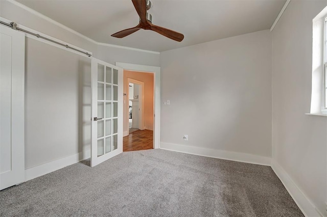 carpeted empty room with ceiling fan