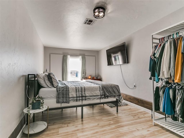 bedroom featuring light hardwood / wood-style flooring