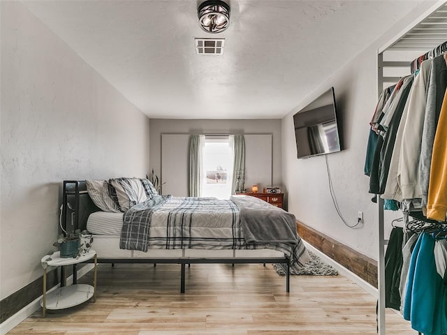 bedroom featuring hardwood / wood-style flooring