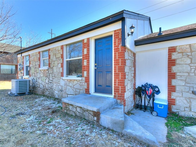 entrance to property featuring central AC