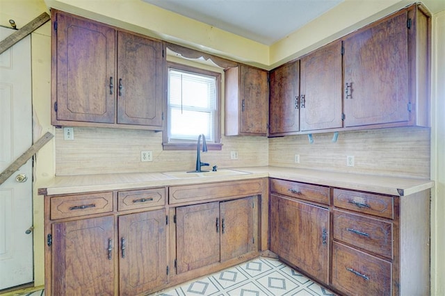 kitchen featuring backsplash and sink