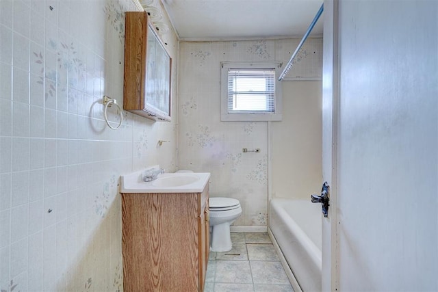 full bathroom featuring toilet, tile patterned flooring, vanity, and bathtub / shower combination