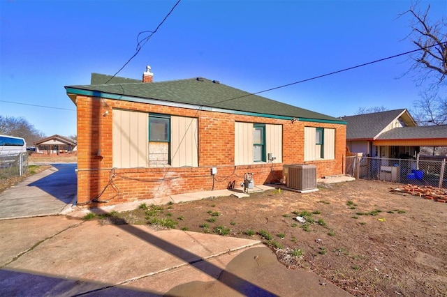 back of property featuring central air condition unit