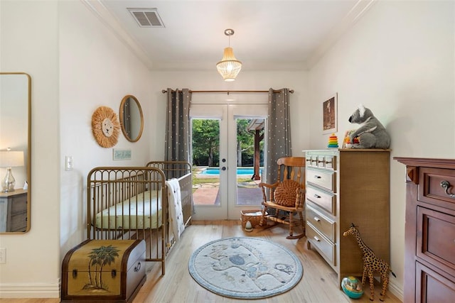 bedroom with crown molding, access to outside, light hardwood / wood-style floors, and french doors