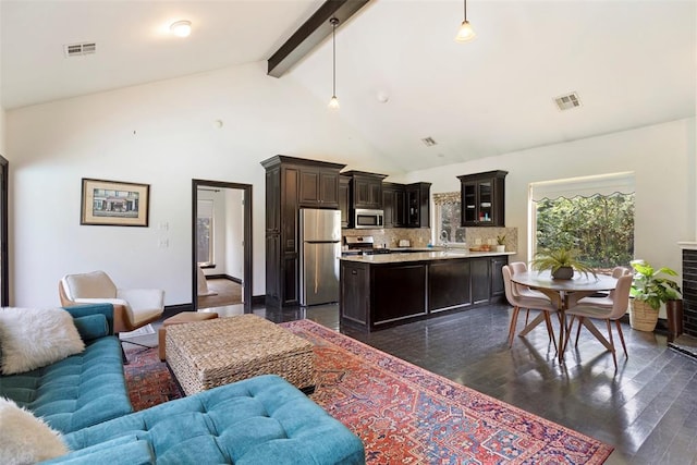 living room with beamed ceiling, dark hardwood / wood-style floors, sink, and high vaulted ceiling