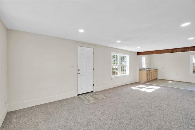 interior space featuring light colored carpet