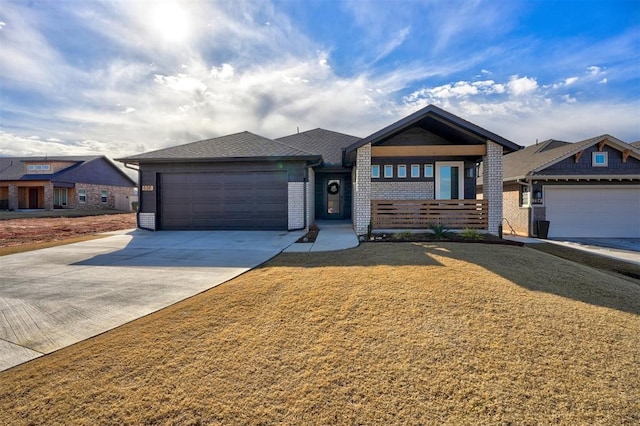 view of front of home featuring a garage and a front lawn