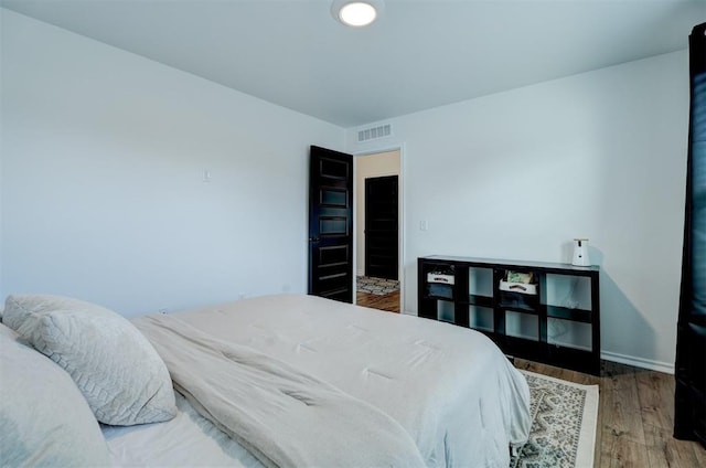 bedroom featuring wood-type flooring