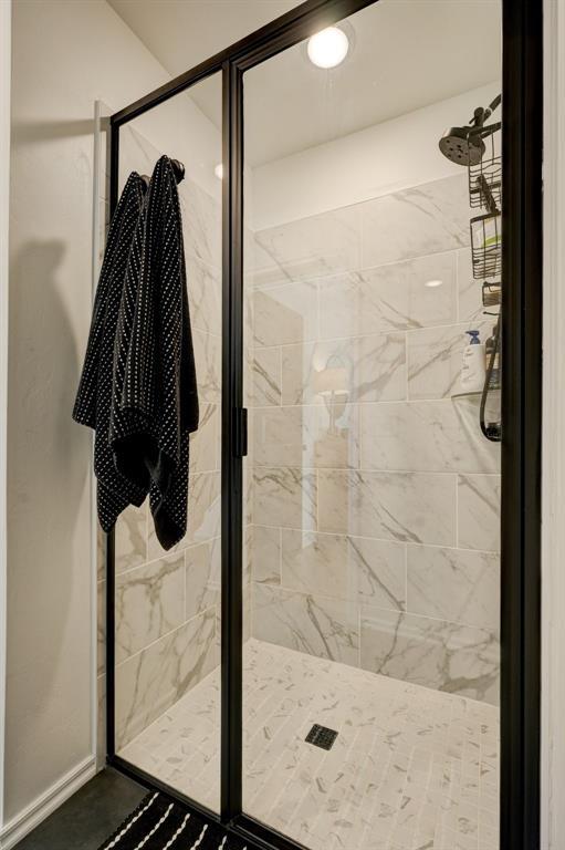 bathroom with a shower with shower door