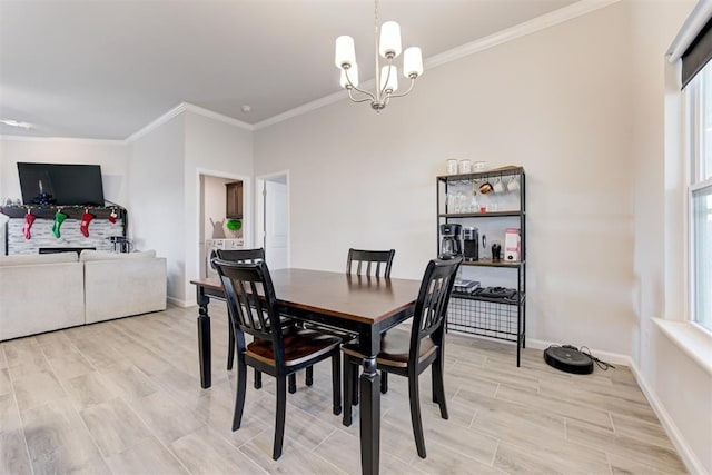 dining room with crown molding and an inviting chandelier