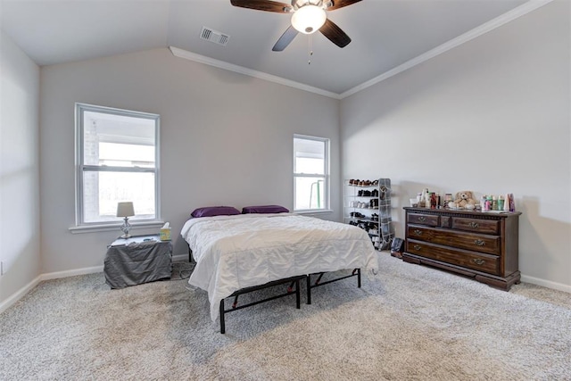 carpeted bedroom with ceiling fan, ornamental molding, multiple windows, and lofted ceiling