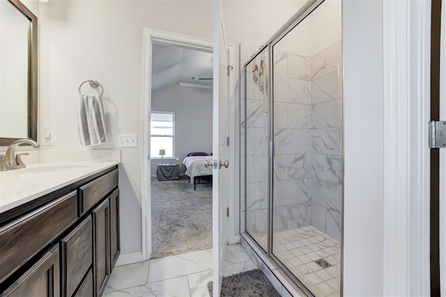 bathroom with vaulted ceiling, walk in shower, and vanity