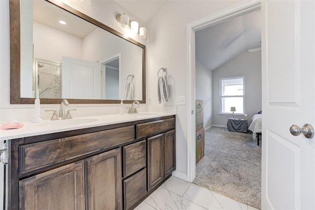 bathroom featuring walk in shower, vanity, and vaulted ceiling